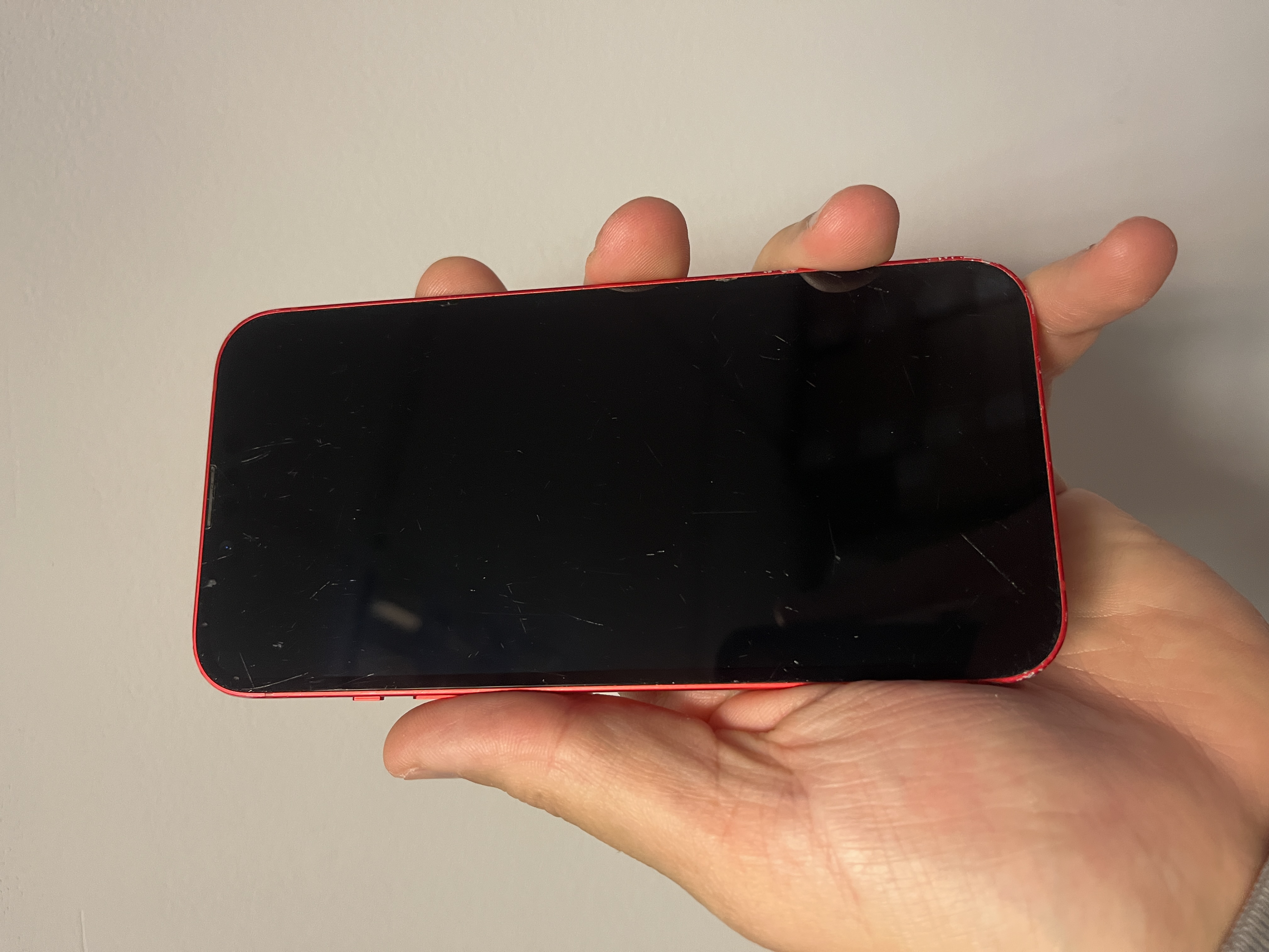 The Apple iPhone 14 256GB Smartphone PRODUCT RED 85 Percent Battery Fully Working - Product View 4 available from Rouge Technologies